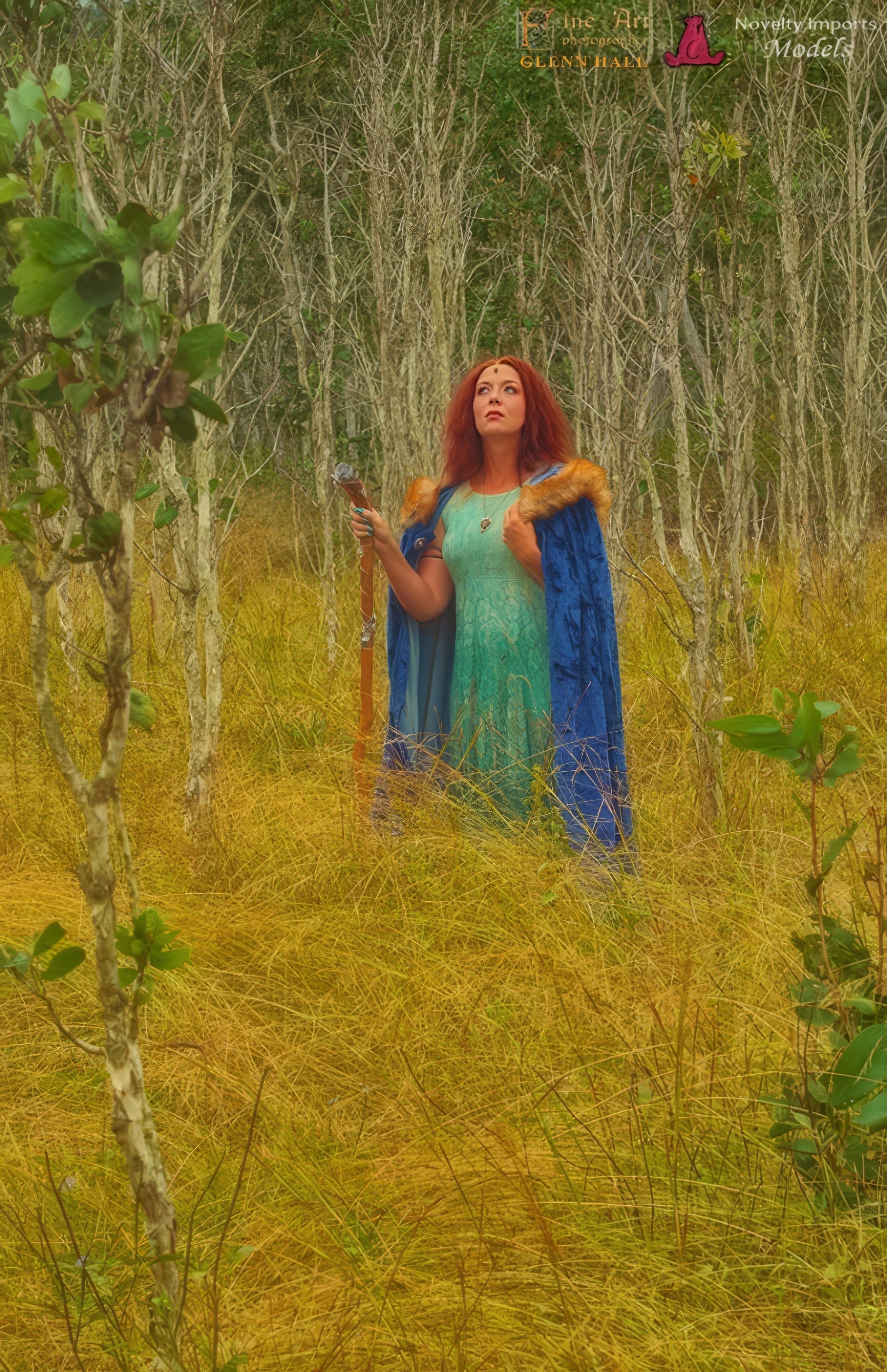 girl in bush with staff